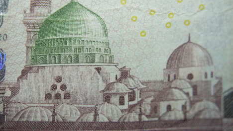 this is the macro view of a normal paper bank not- money- currency ofsaudi arabia 100 riyals bill