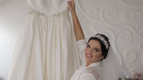 Beautiful-and-lovely-bride-in-night-gown-and-veil.-Wedding-dress.-Slow-motion