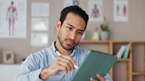 doctor reviewing patient information on a tablet