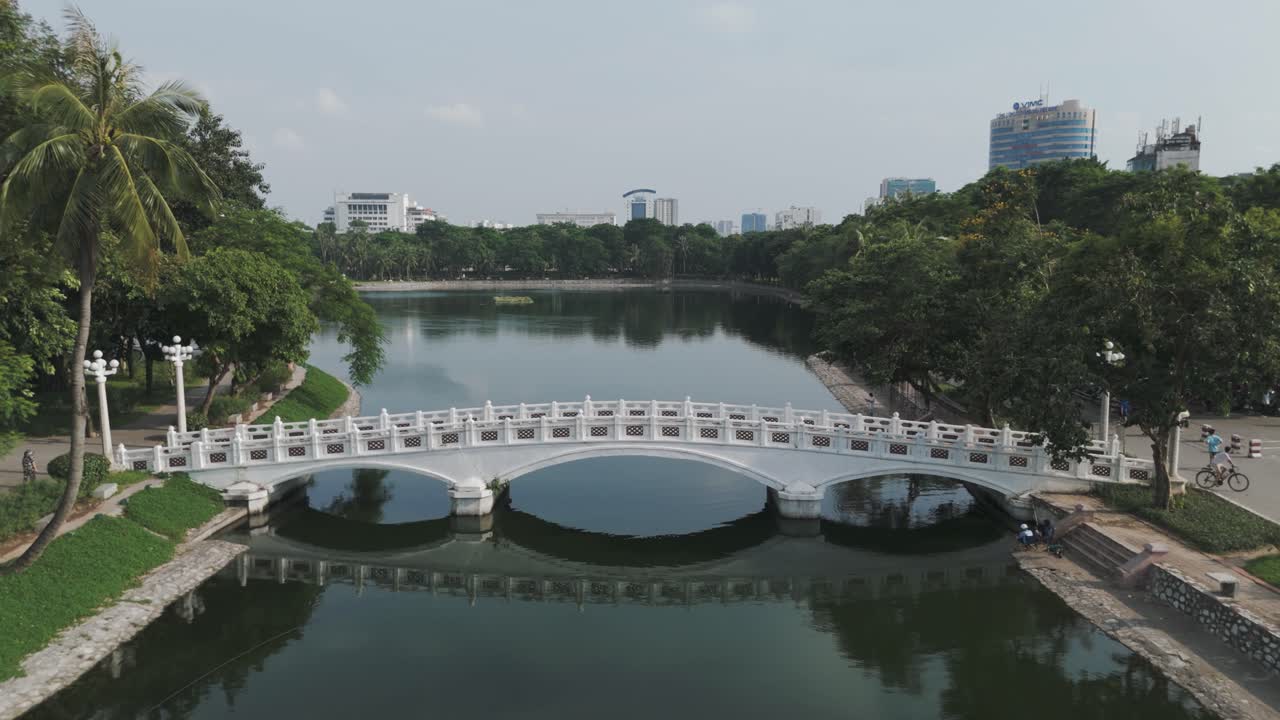 Drone aerial of the bridge to Uncle Ho and Ton Monument in Hanoi, Vietnam, showcasing the historic landmark, urban scenery, and cultural significance, ideal for travel, tourism, and heritage projects