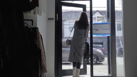 dynamic shot of woman leaving retail store