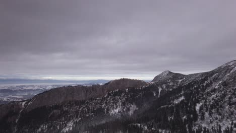 Cableway-view-ascending-Kasprowy-Wierch-snowy-high-Tatras-mountain-range-extreme-terrain-skyline