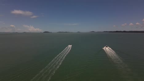 overhead aerial following clip of two boats in remote northern australia