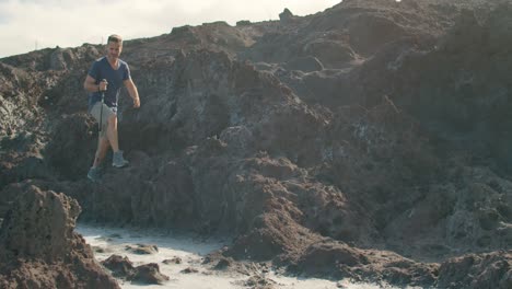 male traveler walking near blowhole