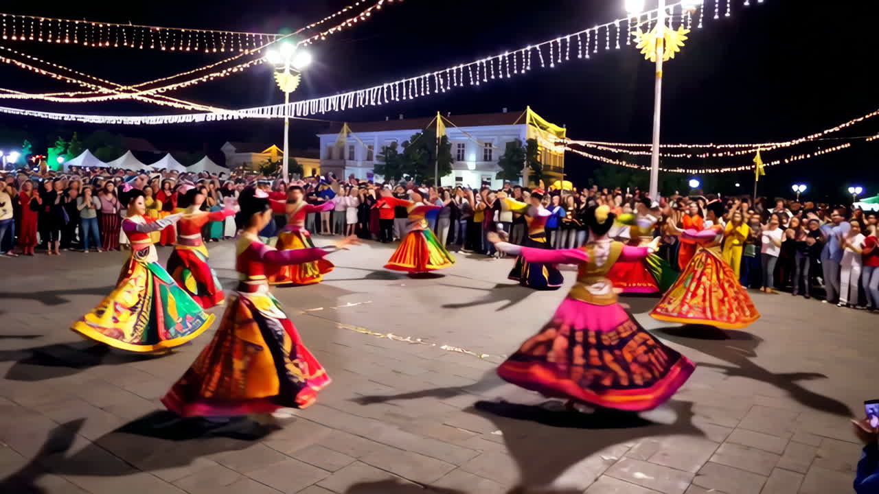 Colorful Traditional Dance Performance in a City Square at Night