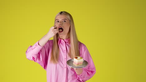 young woman enjoying a delicious strawberry cake