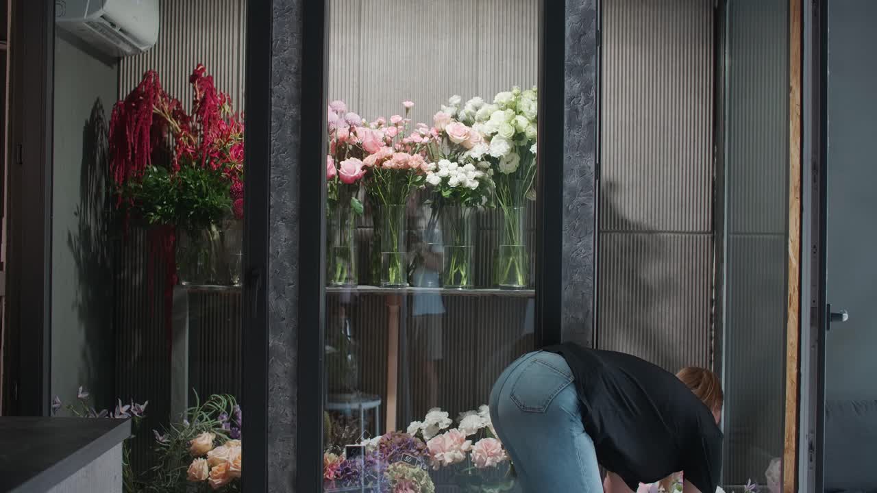 Woman preparing bouquets in a flower shop