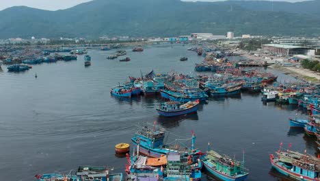 aerial view of a fishing boat arriving the bay in da nang, vietnam