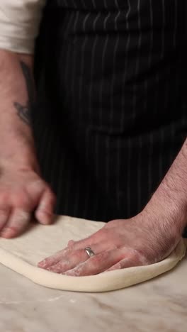 chef making pizza dough