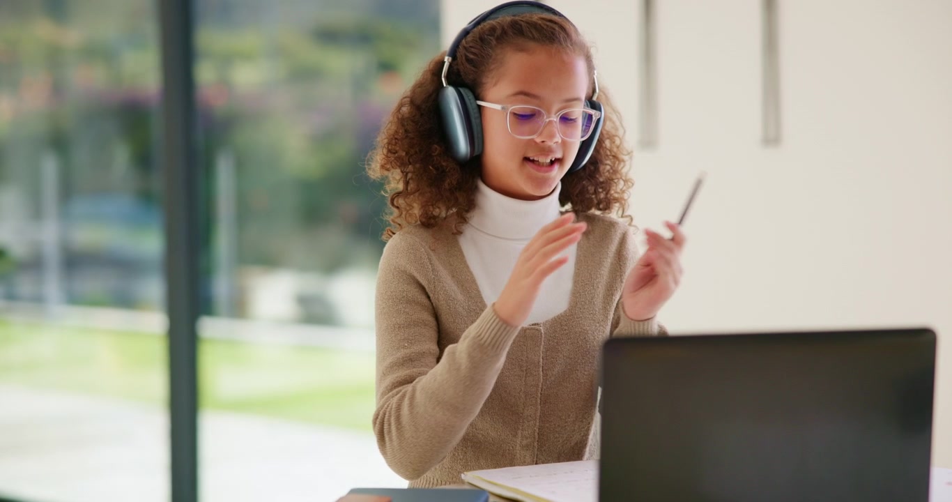Young Girl Participating in Online Class on Laptop