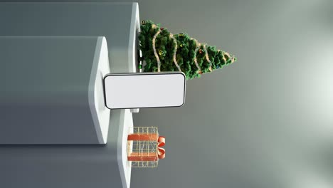 teléfono inteligente, árbol de navidad, y regalo envuelto en fondo blanco