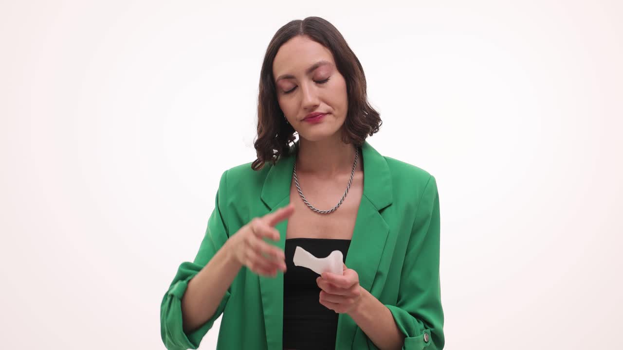 Woman experiencing cold and flu symptoms, including headache and blowing nose