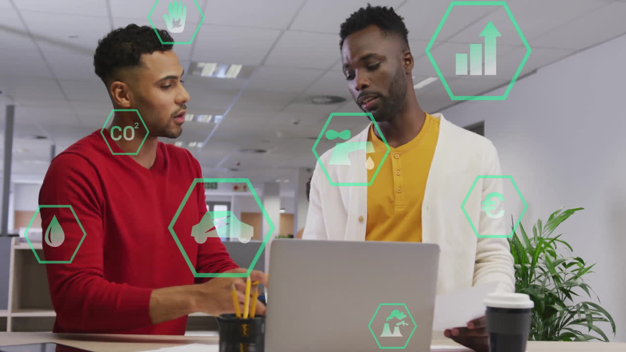 Discussing environmental data, two men in office with green animation overlay