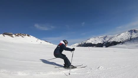 skier doing a carving turn in slow motion