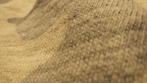 macro close up over camo patterned clothing material