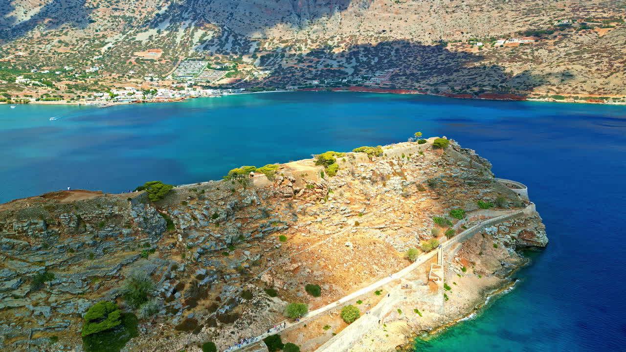 Spinalonga is an ancient, uninhabited island fortress in the Gulf of Elounda, north-eastern Crete, Greece - aerial parallax
