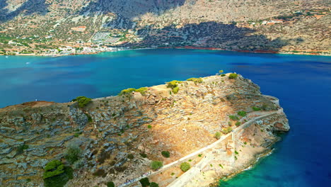 spinalonga is an ancient, uninhabited island fortress in the gulf of elounda, north-eastern crete, greece - aerial parallax