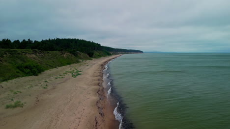 forward flying over jurkalne bluffs, baltic sea coastline in latvia