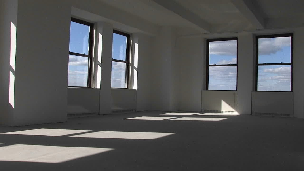 A room located on the top floor of a skyscrapper