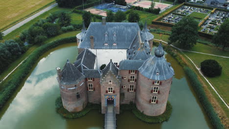 Ammersoyen-castle:-aerial-view-traveling-in-to-the-entrance-to-the-beautiful-castle-and-seeing-the-bridge-and-the-moat-that-surrounds-it