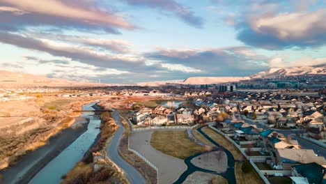 morning sunrise cloudscape aerial hyperlapse above a river pathway trail and suburban community