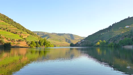 Idyllic-View-Of-A-River-With-Mirror-Reflections-At-Douro-Valley-In-Portugal