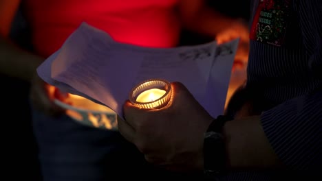 group of candles at night turned on during a dia de los muertos celebration in the dominican republic