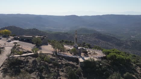 Madonna-statue-and-Our-Lady-of-Cabeza-sanctuary-Andalusia-Spain-AERIAL-ORBITAL-REVEAL