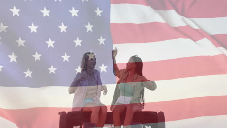 Animation-of-flag-of-usa-over-happy-diverse-women-on-car-by-beach-in-summer