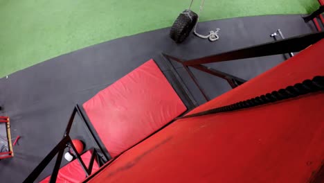 woman performing rope climb exercise in fitness gym 4k