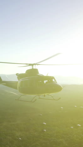 helicopter soaring into the golden embrace of a serene sunrise over mountains