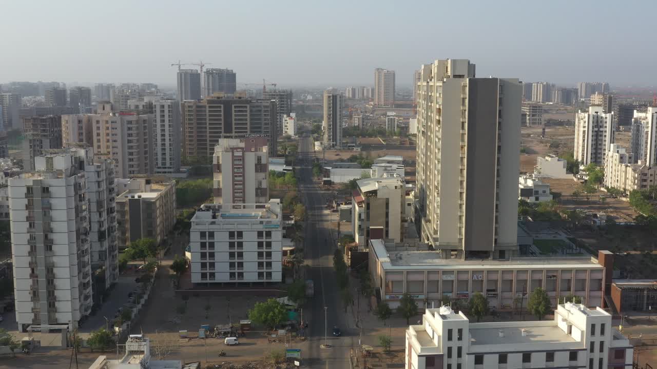 Aerial View of a Modern Cityscape with High-Rise Buildings and Construction