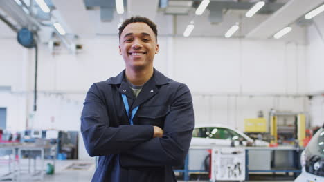 portrait of male student studying for auto mechanic apprenticeship at college