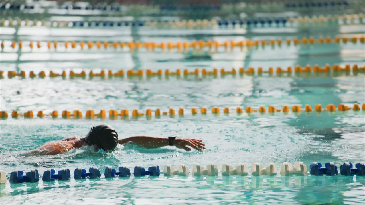 A Competitive Swimmer's Journey Through the Pool: From Start to Finish, Capturing the Struggles and Triumphs in the World of Swimming