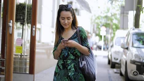 Attractive-woman-walking-down-an-urban-street