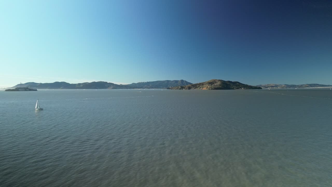 Pan drone shot of Treasure Island in the day with North Pacific Ocean in California, USA