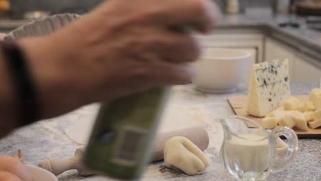 crop cook spraying baking dish with oil spray at home