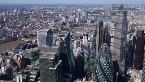 close aerial view of the city of london towers, river thames with the shard and tower bridge