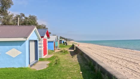 colorful beach boxes by the serene ocean