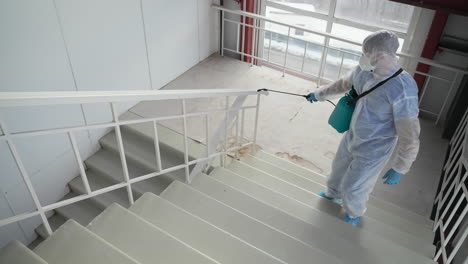 disinfecting stairs in a building