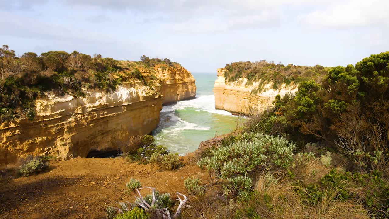 Loch Ard Gorge's stunning cliffs and ocean captured in daylight, showcasing natural beauty and rugged landscapes of Port Campbell, Australia