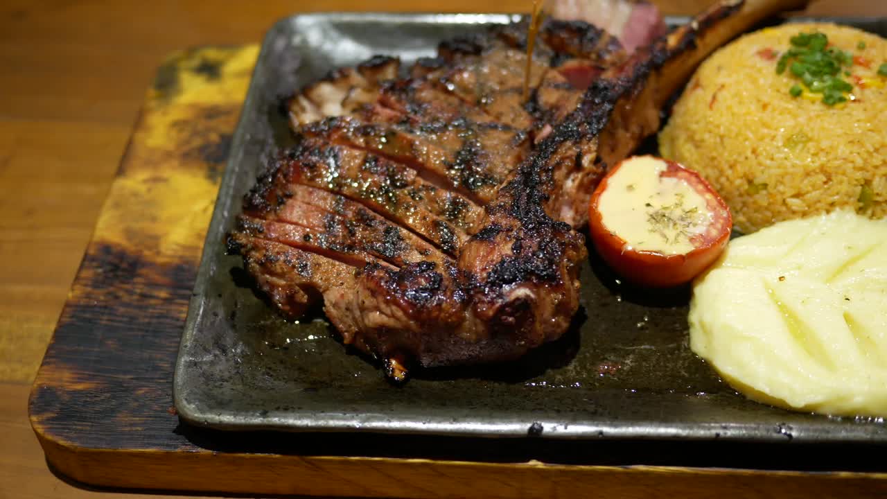 Grilled Rib Eye Steak with Mashed Potatoes and Rice