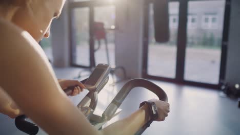 handheld view of woman with kettlebell exercising at gym