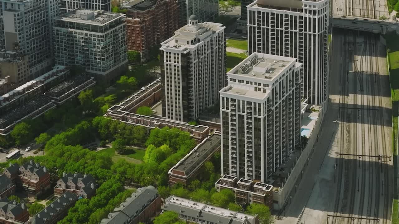 Chicago aerial view showing buildings, train tracks, and busy streets