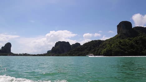 yacht trip across andaman sea in thailand with rocky island in summer