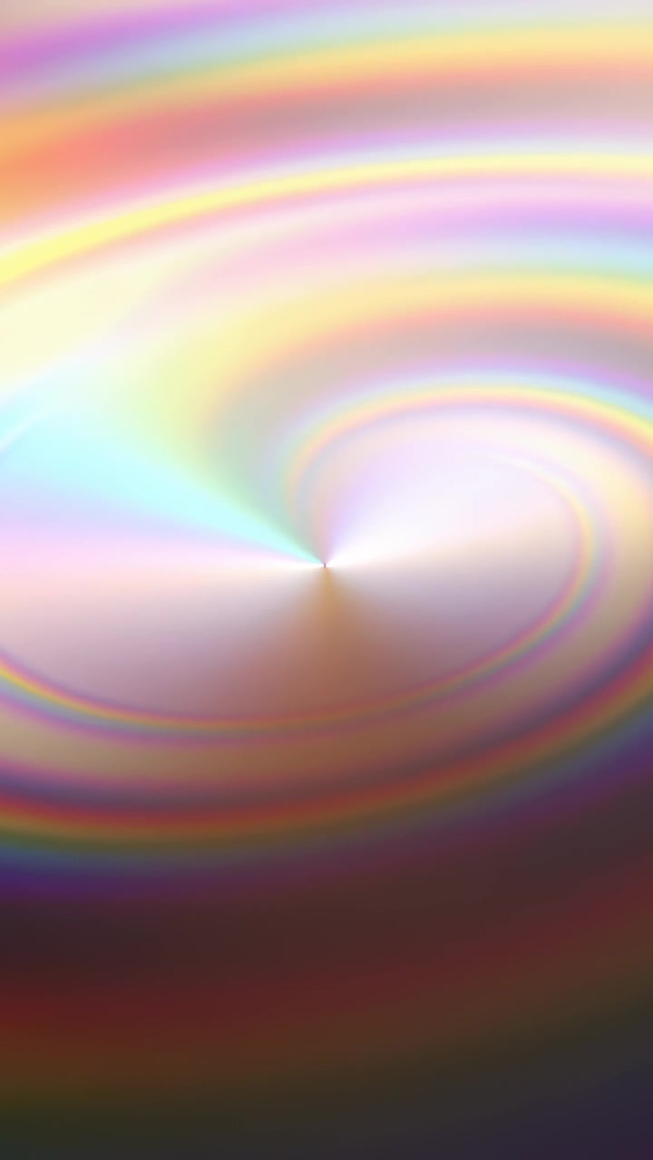 Video verticale: Vortice rotante con anelli cangianti, un punto bianco e un cuneo sullo schermo, creati da una luce in movimento.