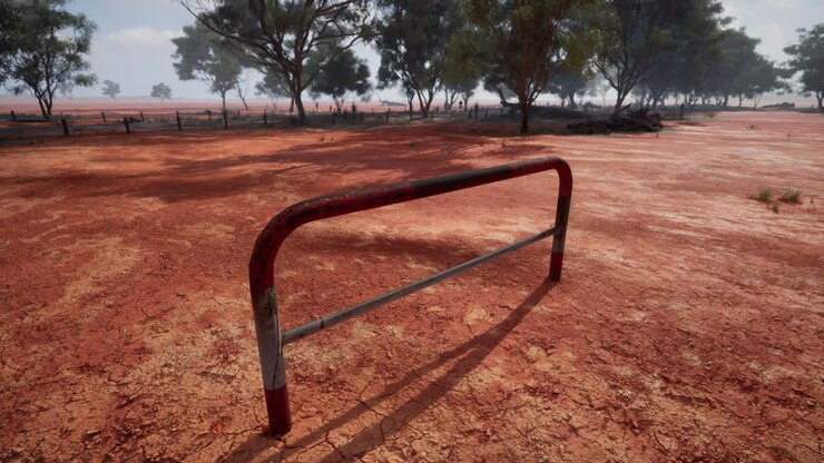 Rusty Metal Barrier in a Red Dirt Outback Landscape