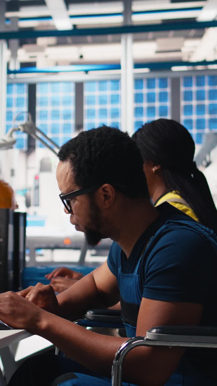 Vertical Video African american wheelchair user testing CAD software for manufacturing