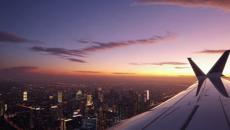 aerial view of a city at sunset from an airplane