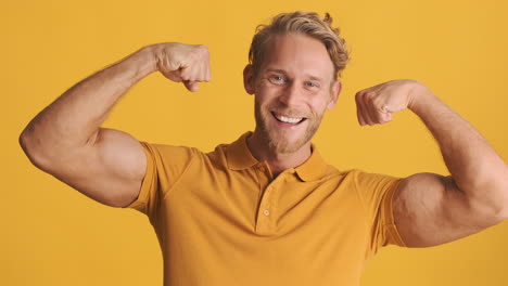 strong blond man showing biceps